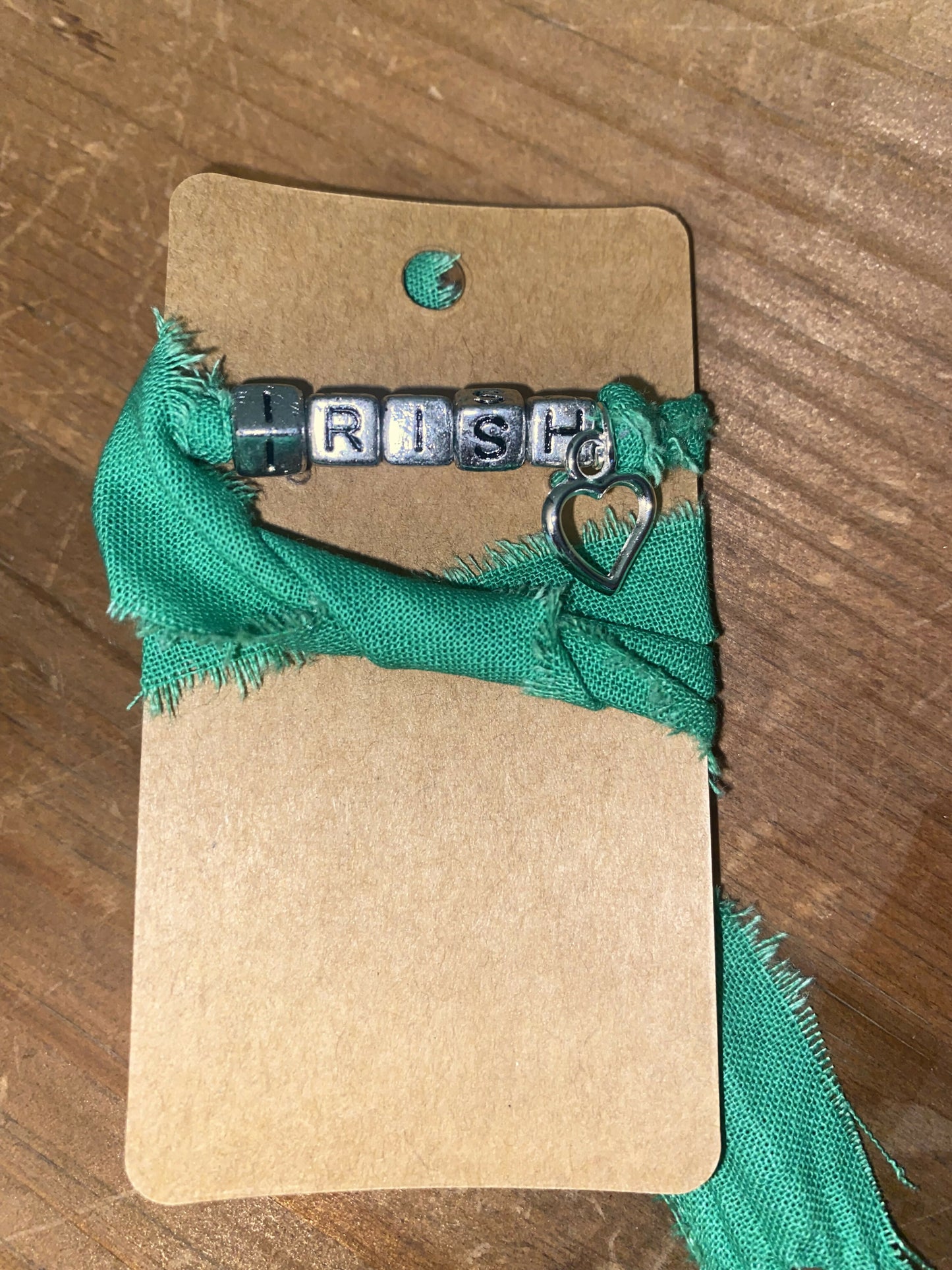 Green wrap with Irish and open heart charm (kid)