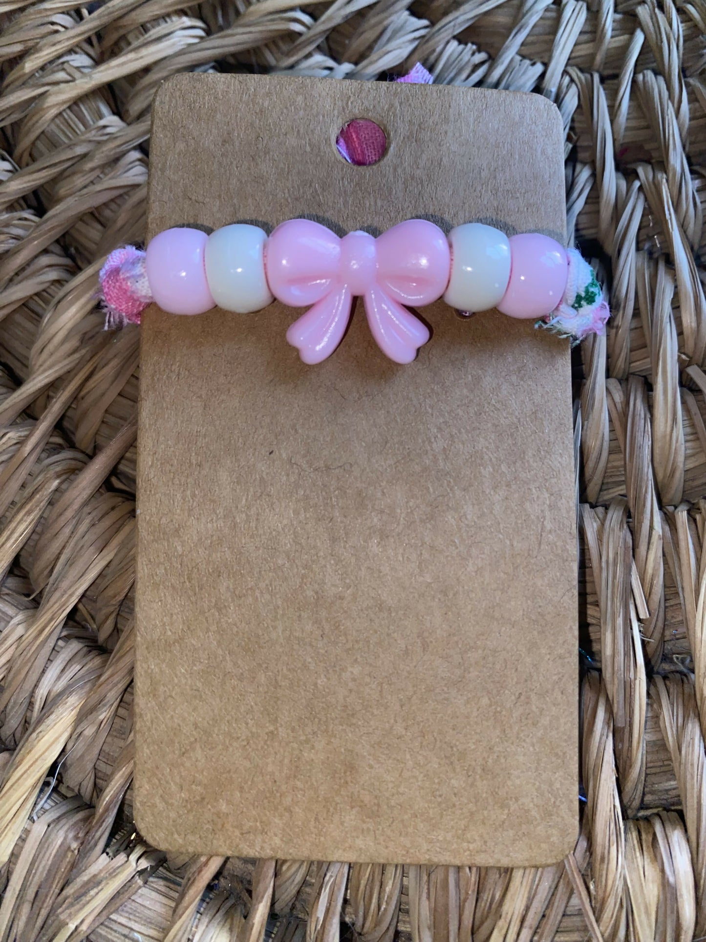 Pink bow wth pink and white beads snowman bracelet