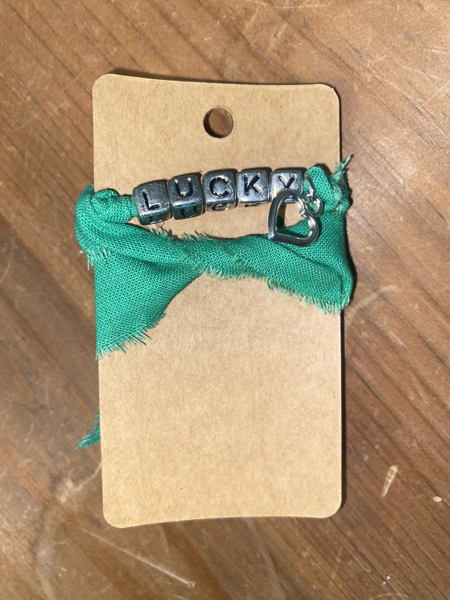 Green Lucky wrap with open heart charm (kid)