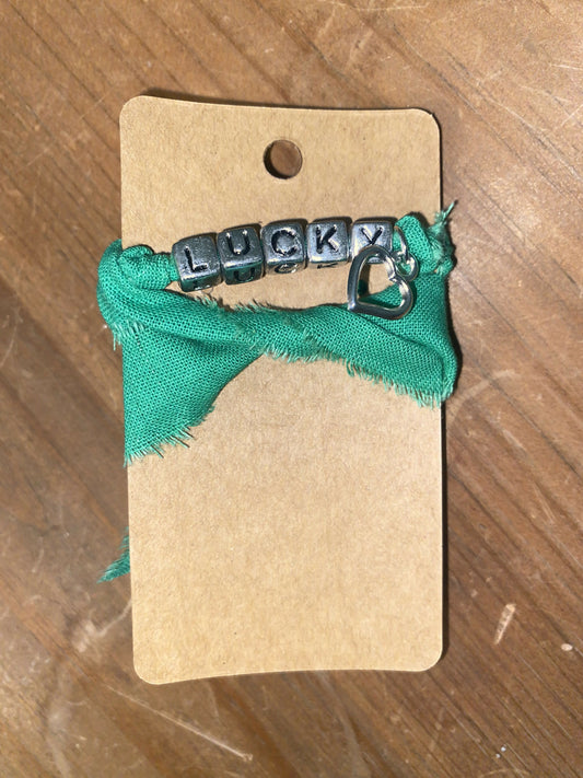 Green Lucky wrap with open heart charm (kid)