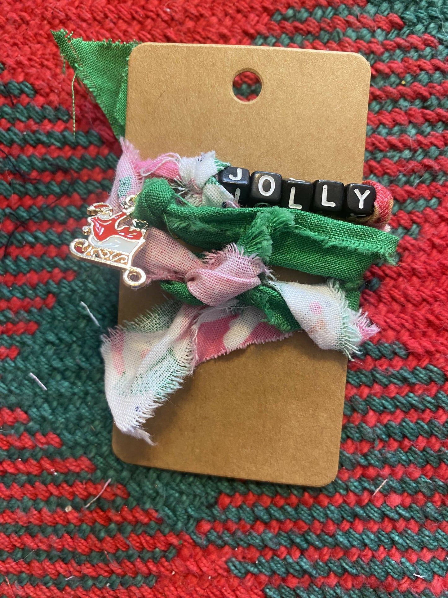 Jolly with Sled Charm