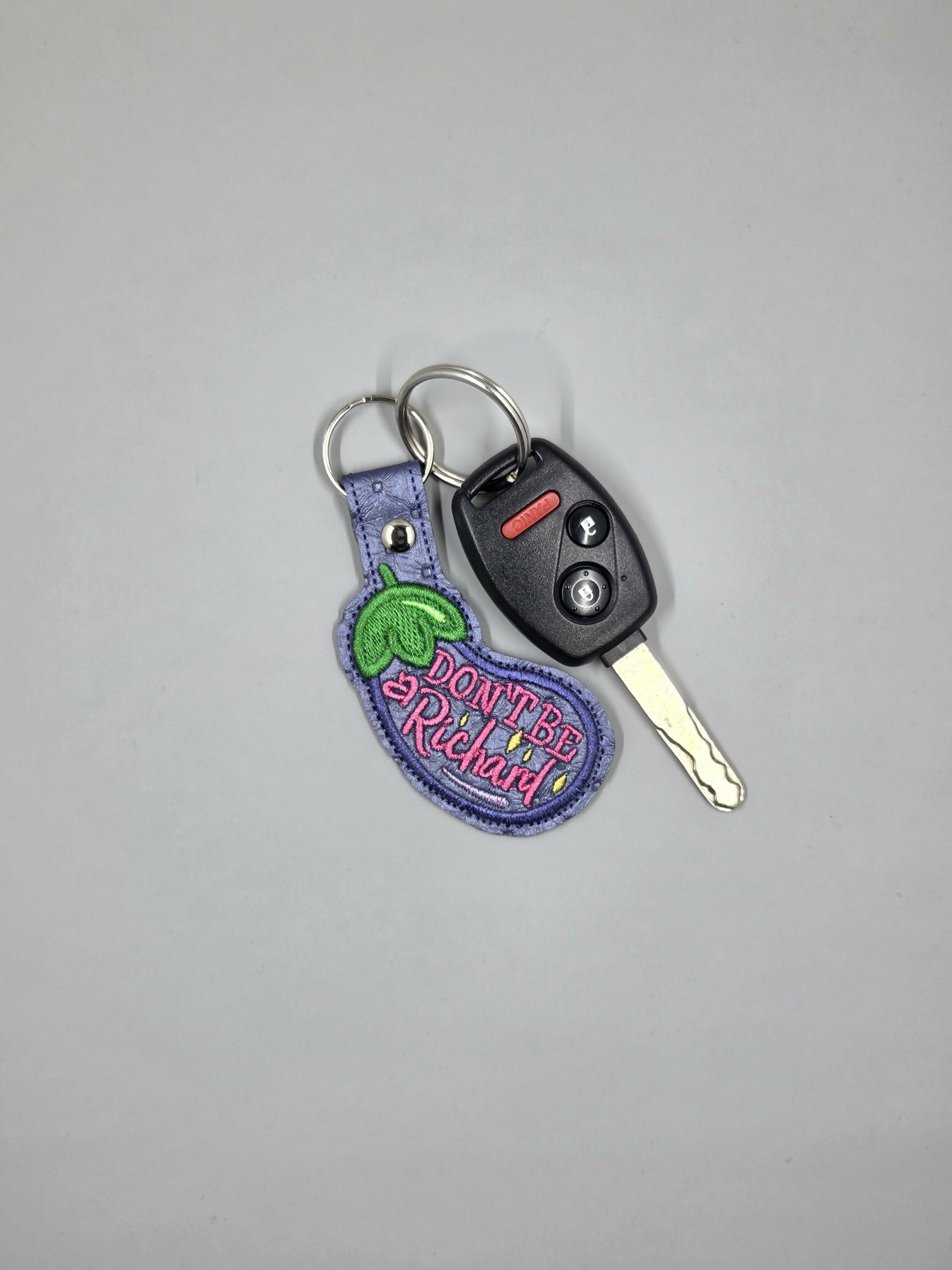 “Don’t Be a Richard” Embroidered Keychain | Funny Eggplant Vinyl Keychain