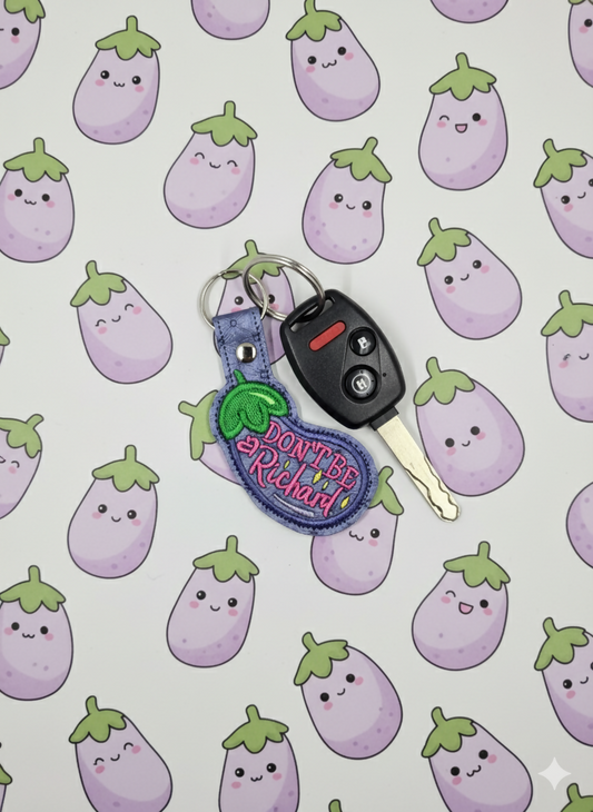 “Don’t Be a Richard” Embroidered Keychain | Funny Eggplant Vinyl Keychain